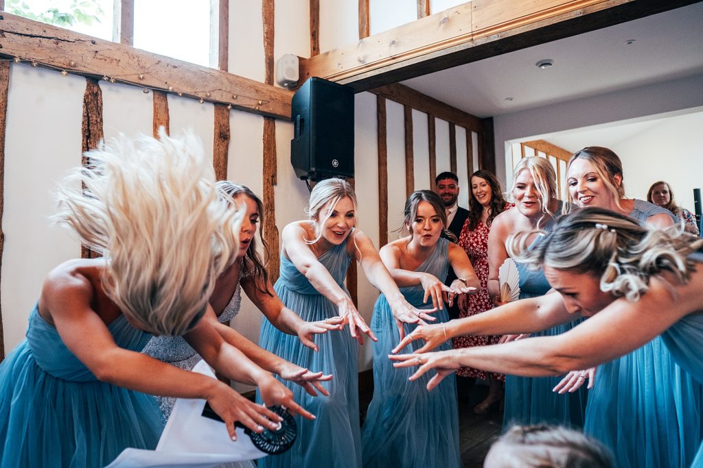Outdoor Maidens Barn wedding with Singing Waiters Best Essex Wedding Photographer