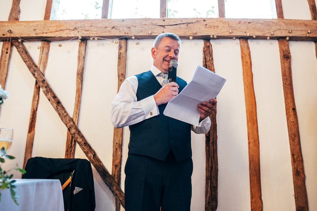Outdoor Maidens Barn wedding with Singing Waiters Best Essex Wedding Photographer