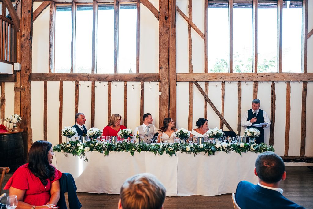 Outdoor Maidens Barn wedding with Singing Waiters Best Essex Wedding Photographer