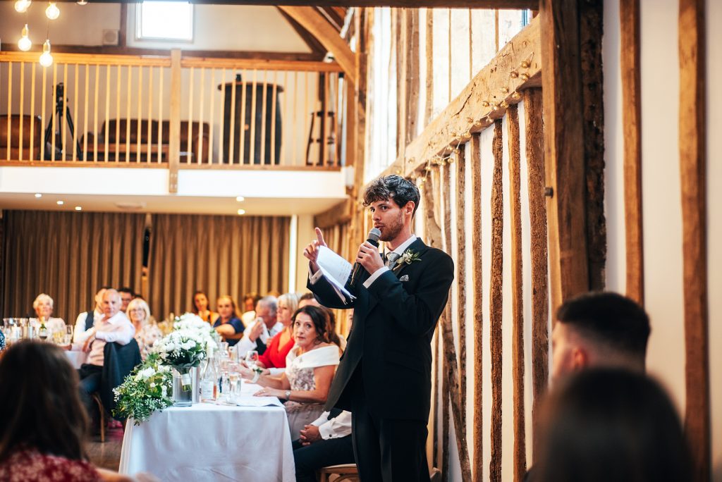 Outdoor Maidens Barn wedding with Singing Waiters Best Essex Wedding Photographer