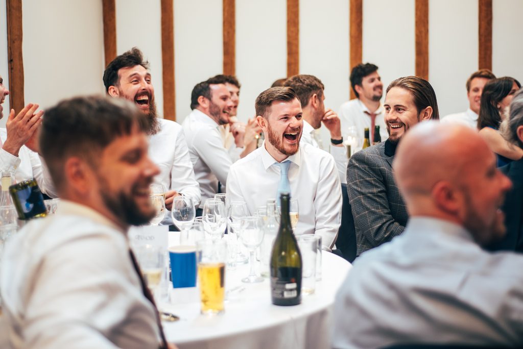 Outdoor Maidens Barn wedding with Singing Waiters Best Essex Wedding Photographer