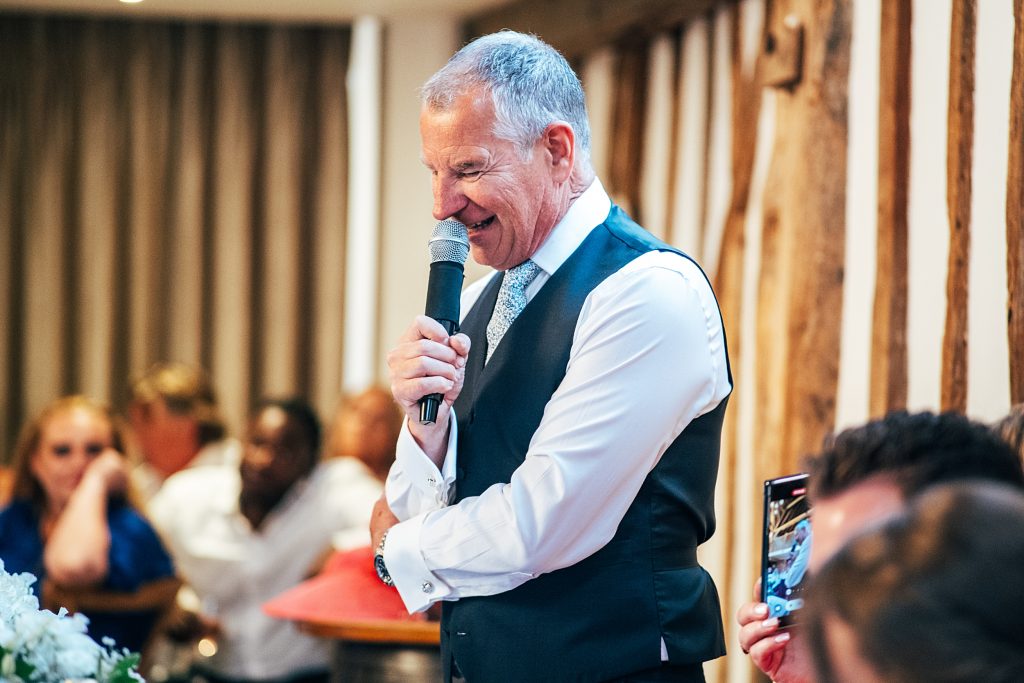 Outdoor Maidens Barn wedding with Singing Waiters Best Essex Wedding Photographer