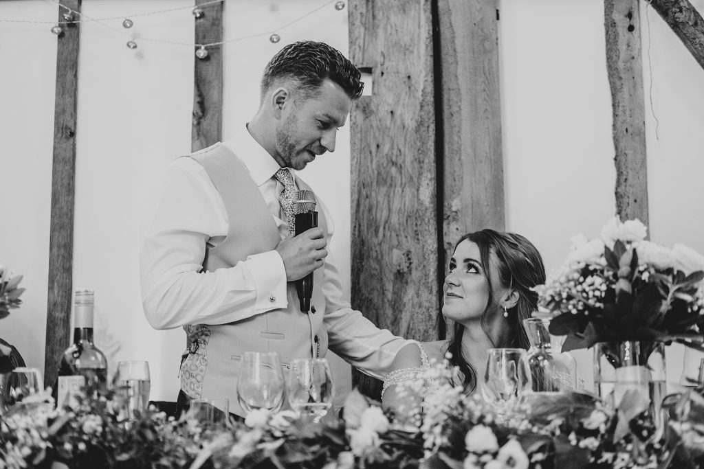 Outdoor Maidens Barn wedding with Singing Waiters Best Essex Wedding Photographer