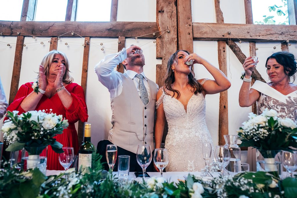 Outdoor Maidens Barn wedding with Singing Waiters Best Essex Wedding Photographer
