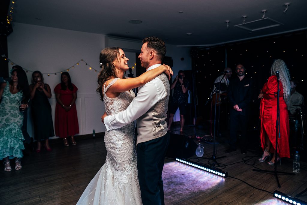 Outdoor Maidens Barn wedding with Singing Waiters Best Essex Wedding Photographer