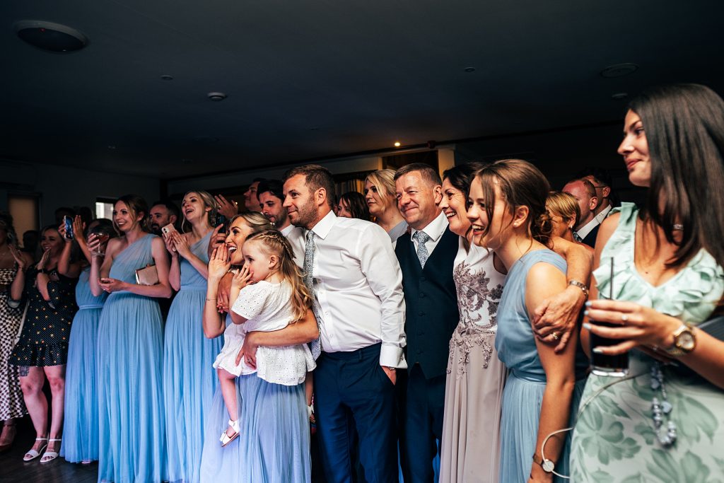 Outdoor Maidens Barn wedding with Singing Waiters Best Essex Wedding Photographer