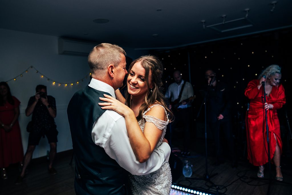 Outdoor Maidens Barn wedding with Singing Waiters Best Essex Wedding Photographer