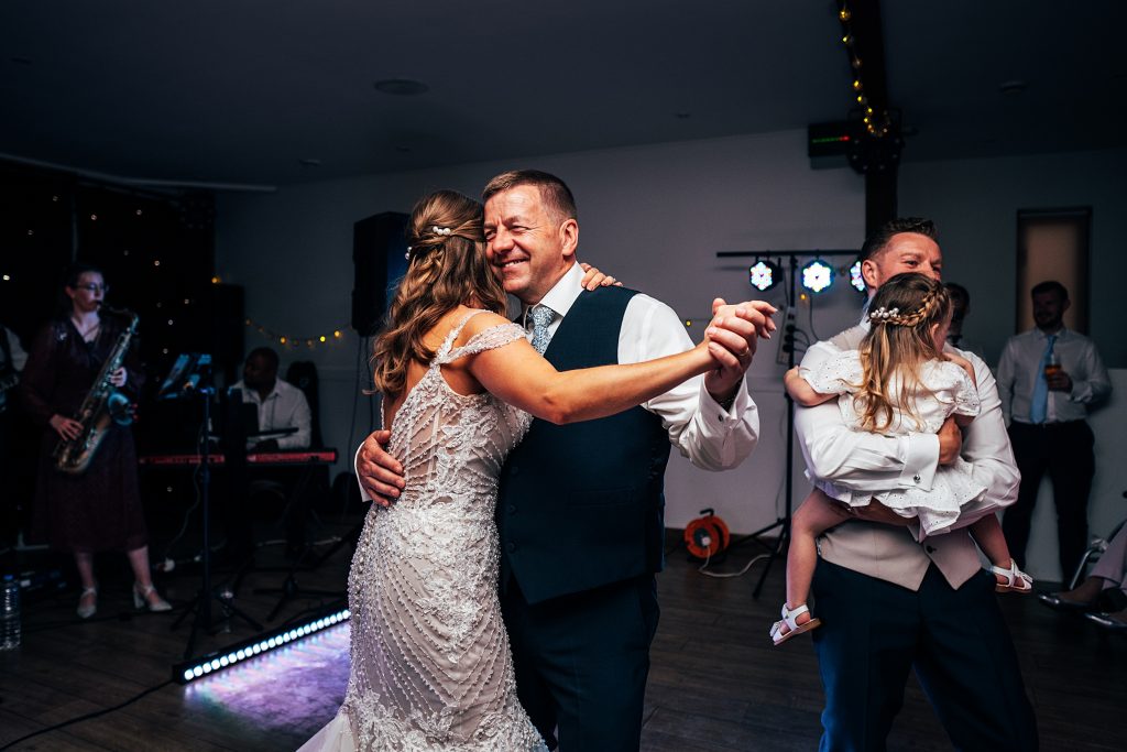 Outdoor Maidens Barn wedding with Singing Waiters Best Essex Wedding Photographer