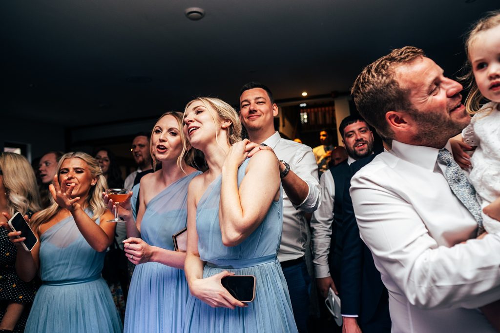 Outdoor Maidens Barn wedding with Singing Waiters Best Essex Wedding Photographer