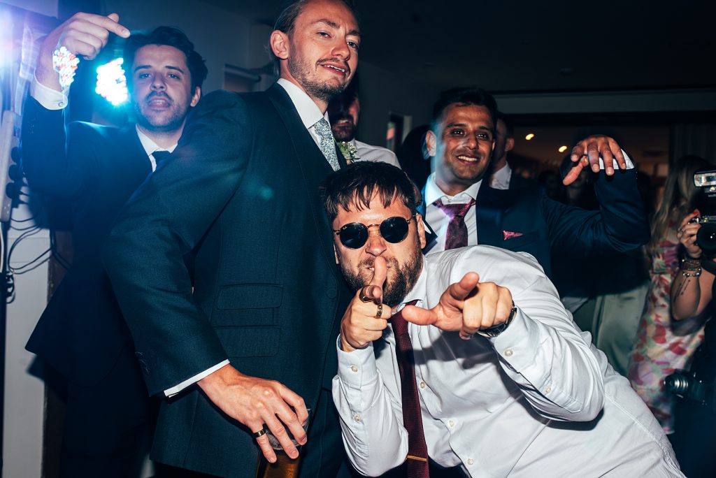 Outdoor Maidens Barn wedding with Singing Waiters Best Essex Wedding Photographer