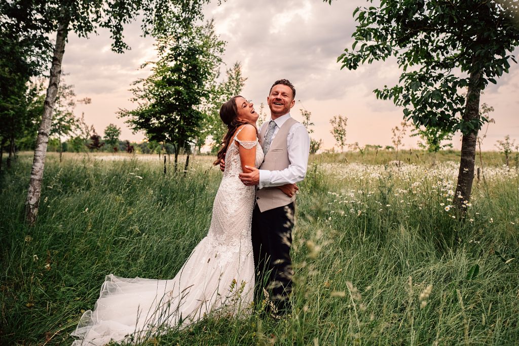 Outdoor Maidens Barn wedding with Singing Waiters Best Essex Wedding Photographer