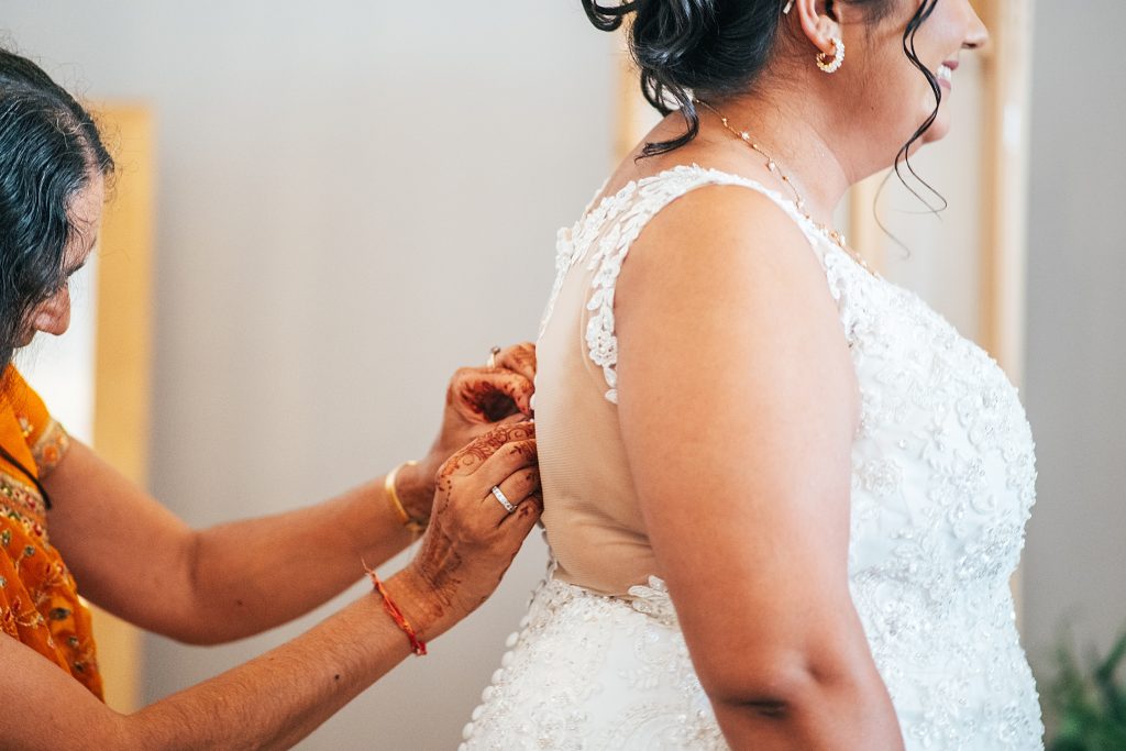 brides mum does up her dress