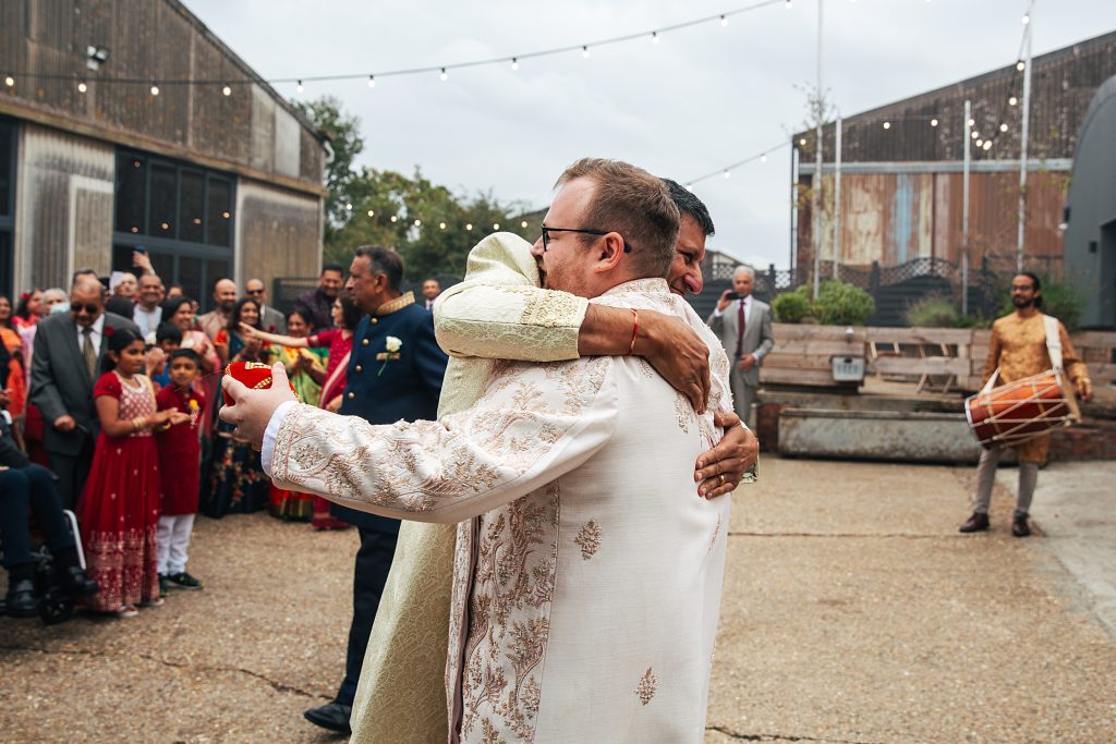 Groom embraces bride's dad for Jaan