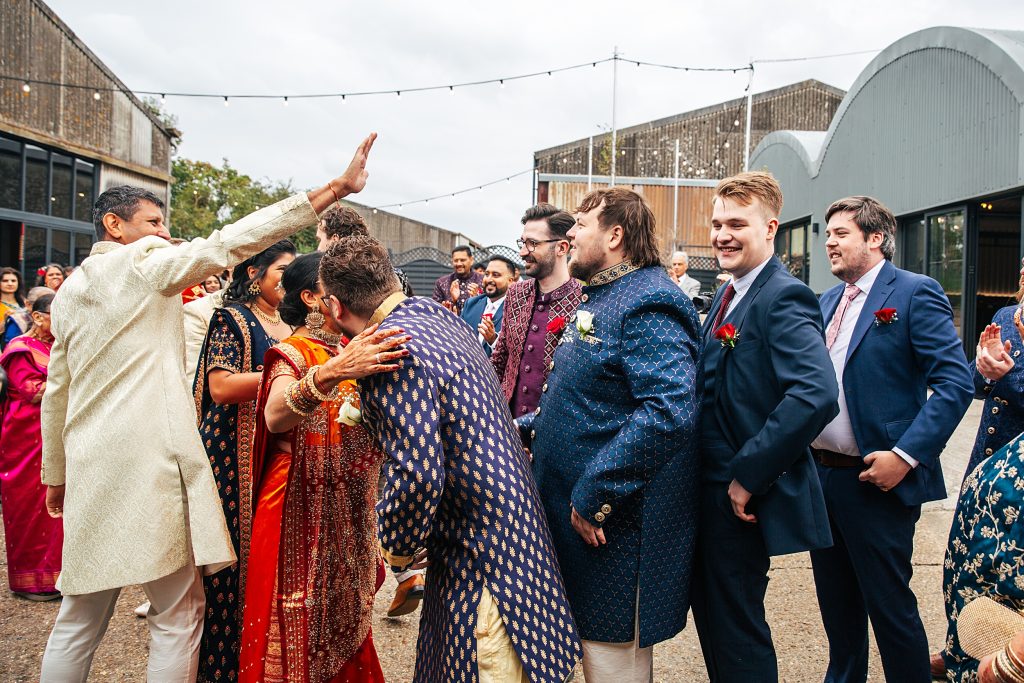 brides family welcome grooms family during Jaan