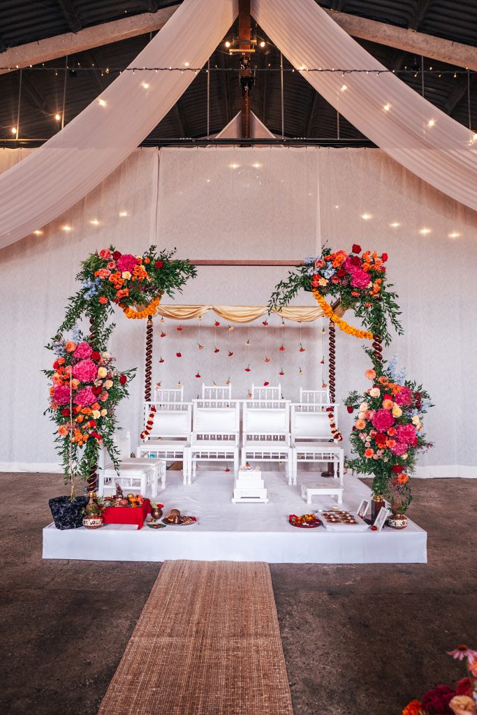 Mandap decorated with bright florals