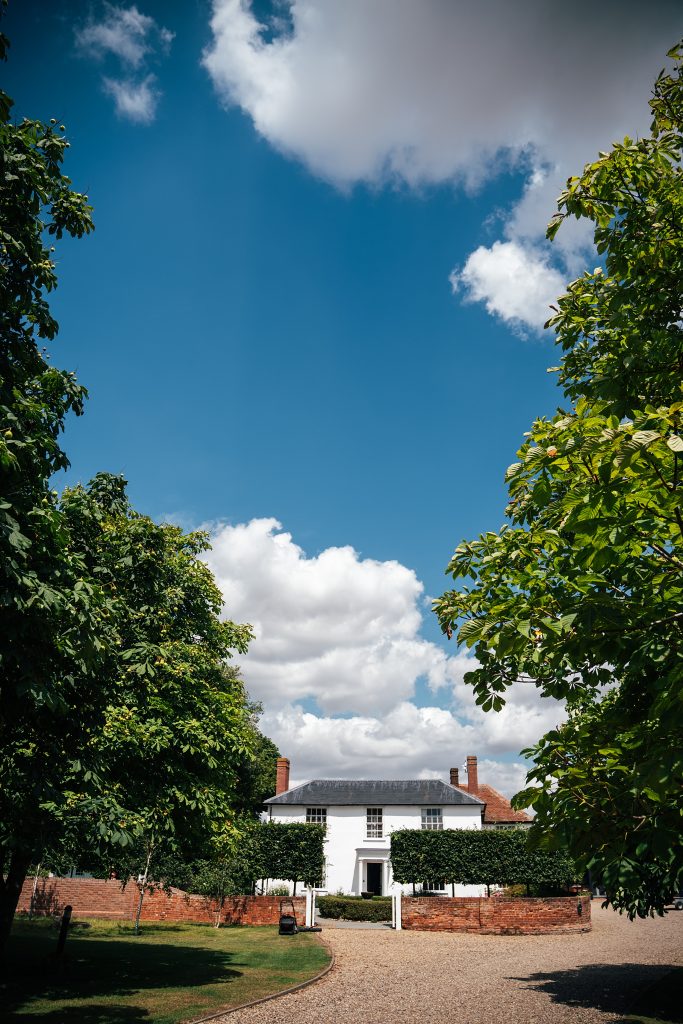 Summer wedding outdoors at Vaulty Manor Essex documentary wedding photographer