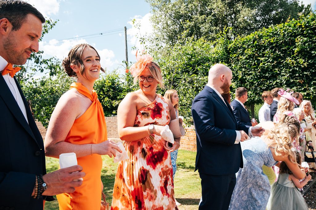 Summer wedding outdoors at Vaulty Manor Essex documentary wedding photographer