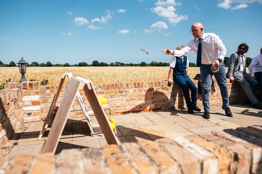 Summer wedding outdoors at Vaulty Manor Essex documentary wedding photographer