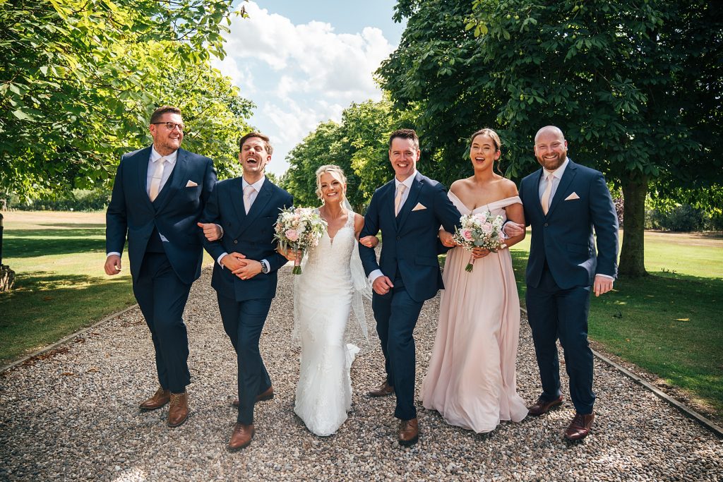 Summer wedding outdoors at Vaulty Manor Essex documentary wedding photographer