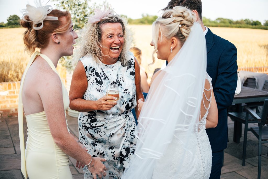 Summer wedding outdoors at Vaulty Manor Essex documentary wedding photographer