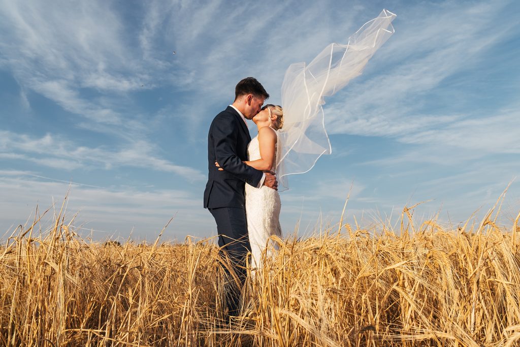 Summer wedding outdoors at Vaulty Manor Essex documentary wedding photographer