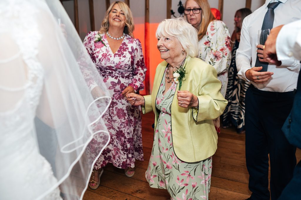 Summer wedding outdoors at Vaulty Manor Essex documentary wedding photographer