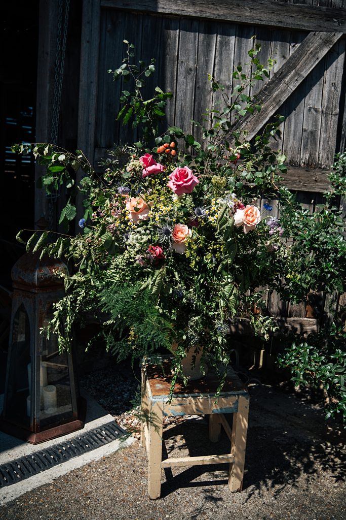 Multi coloured Summer wedding with a bride wearing green at The Barns at Lodge Farm. Essex documentary wedding photographer