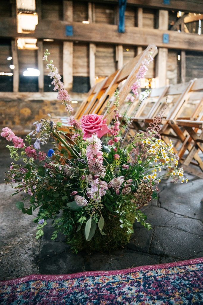 Multi coloured Summer wedding with a bride wearing green at The Barns at Lodge Farm. Essex documentary wedding photographer