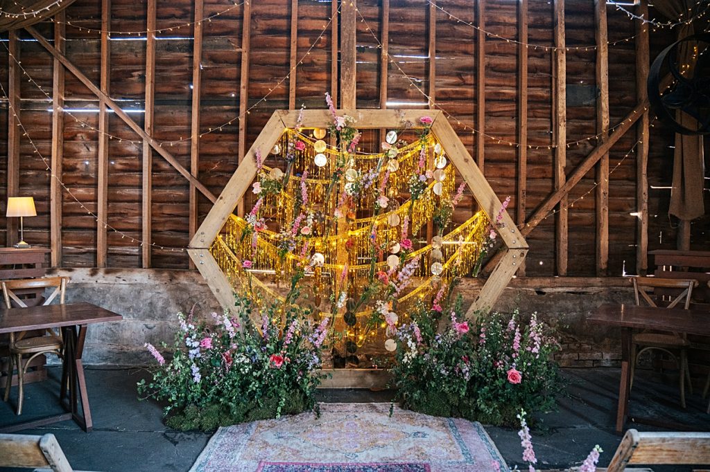 Multi coloured Summer wedding with a bride wearing green at The Barns at Lodge Farm. Essex documentary wedding photographer