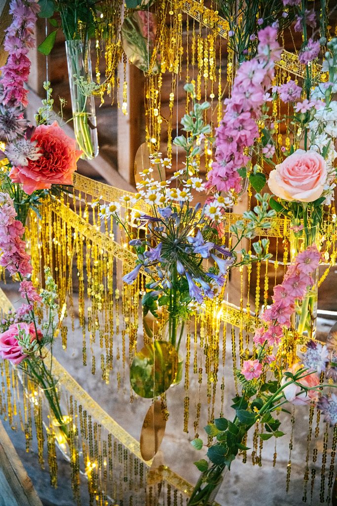 Multi coloured Summer wedding with a bride wearing green at The Barns at Lodge Farm. Essex documentary wedding photographer