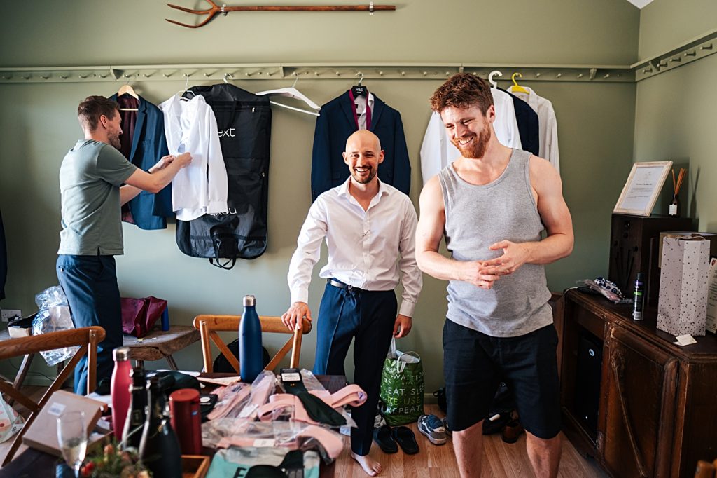 Multi coloured Summer wedding with a bride wearing green at The Barns at Lodge Farm. Essex documentary wedding photographer