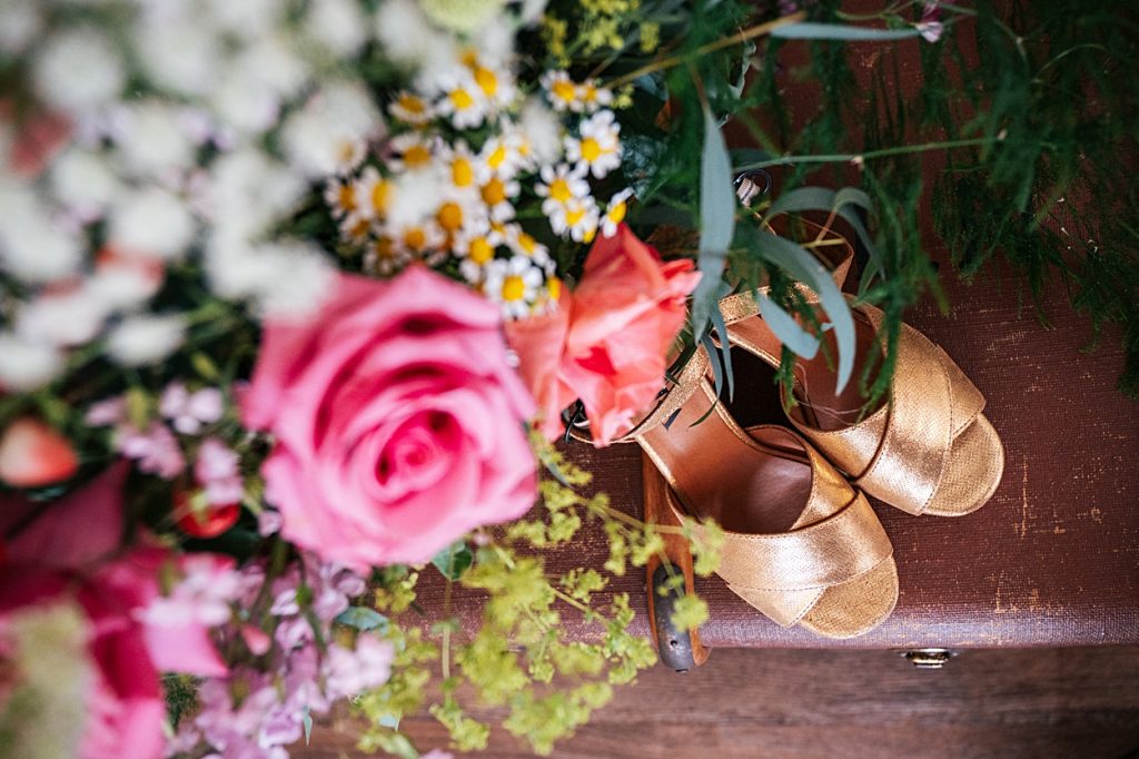 Multi coloured Summer wedding with a bride wearing green at The Barns at Lodge Farm. Essex documentary wedding photographer