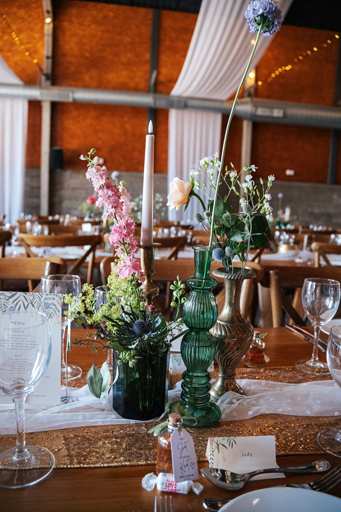Multi coloured Summer wedding with a bride wearing green at The Barns at Lodge Farm. Essex documentary wedding photographer