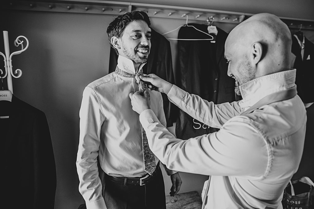 Multi coloured Summer wedding with a bride wearing green at The Barns at Lodge Farm. Essex documentary wedding photographer