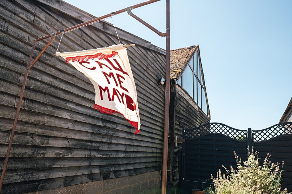 Multi coloured Summer wedding with a bride wearing green at The Barns at Lodge Farm. Essex documentary wedding photographer