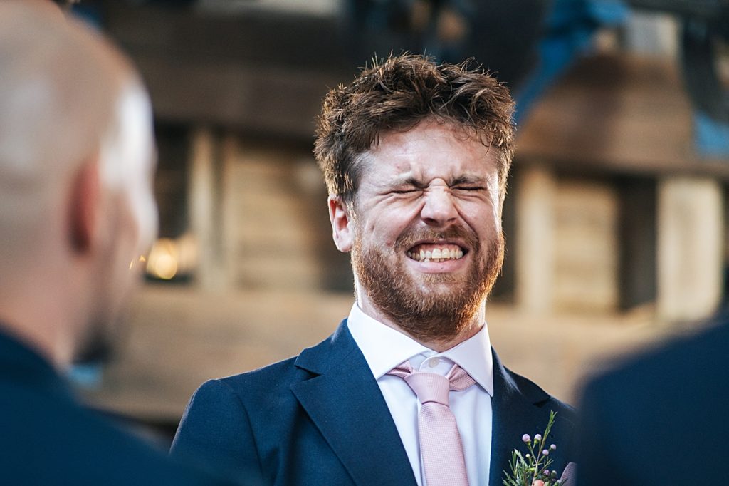 Multi coloured Summer wedding with a bride wearing green at The Barns at Lodge Farm. Essex documentary wedding photographer