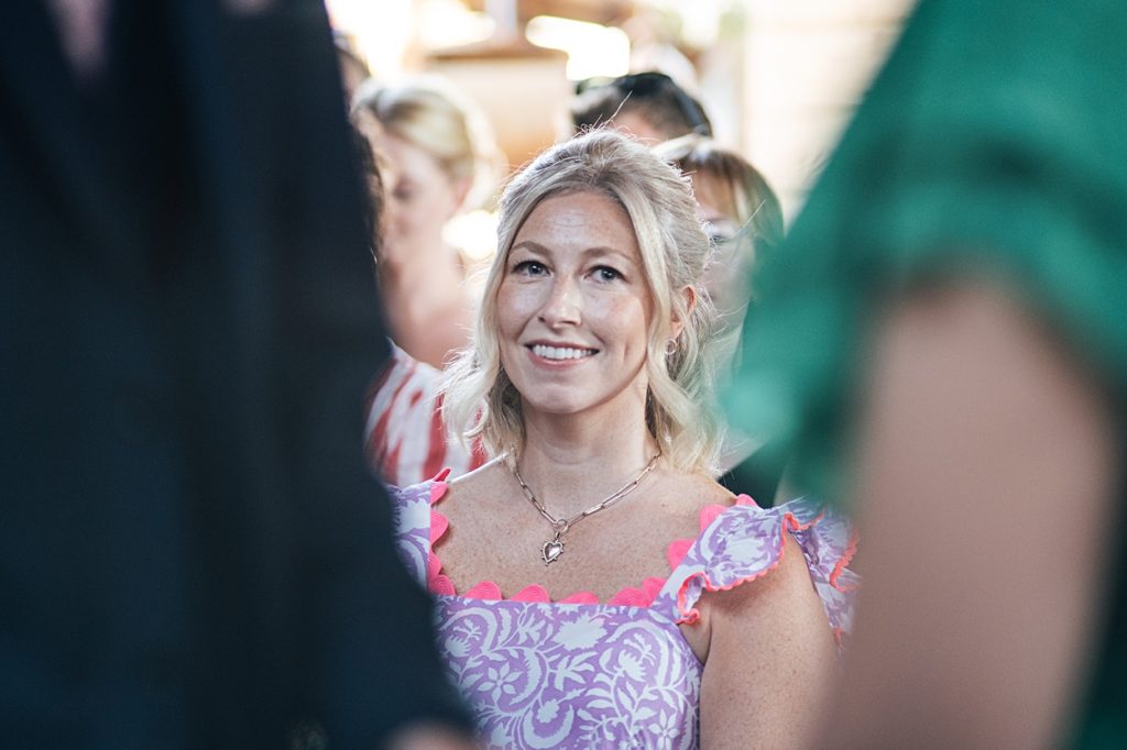 Multi coloured Summer wedding with a bride wearing green at The Barns at Lodge Farm. Essex documentary wedding photographer