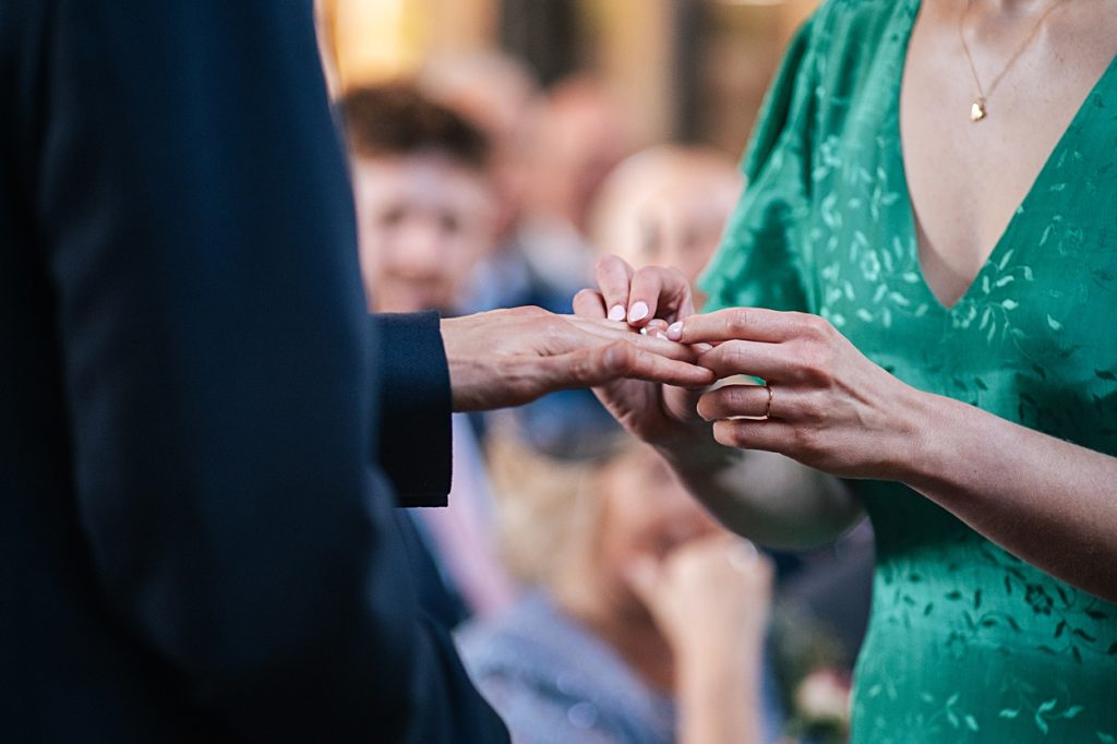 Multi coloured Summer wedding with a bride wearing green at The Barns at Lodge Farm. Essex documentary wedding photographer