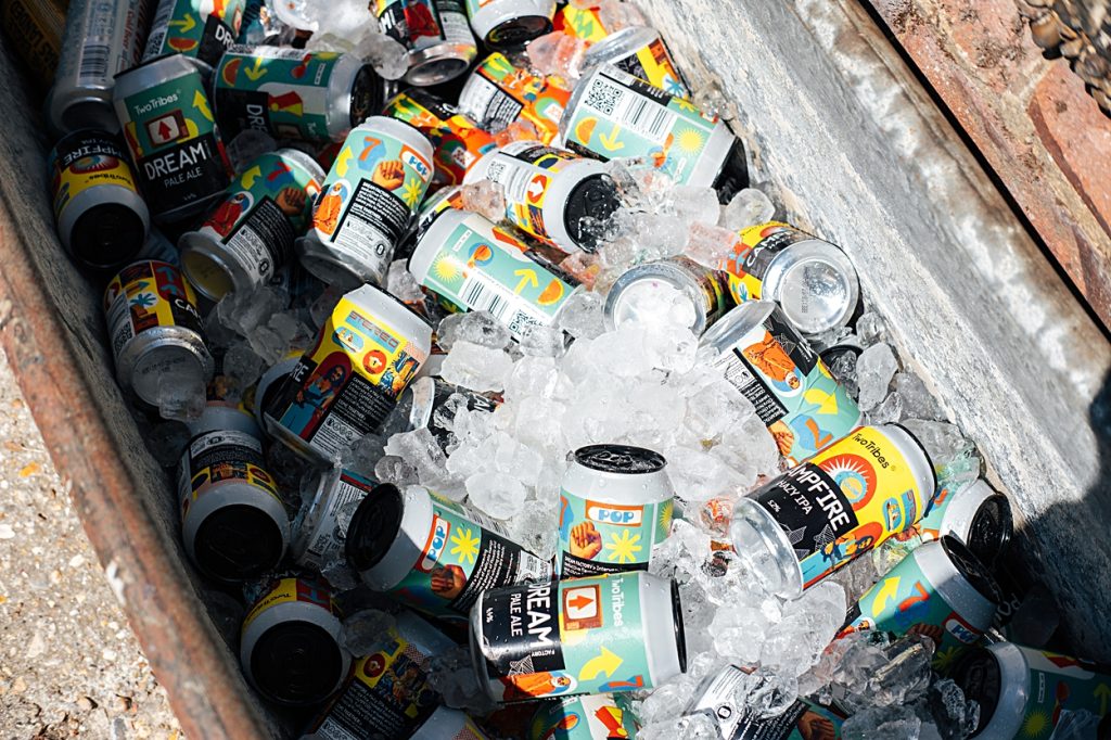 Multi coloured Summer wedding with a bride wearing green at The Barns at Lodge Farm. Essex documentary wedding photographer