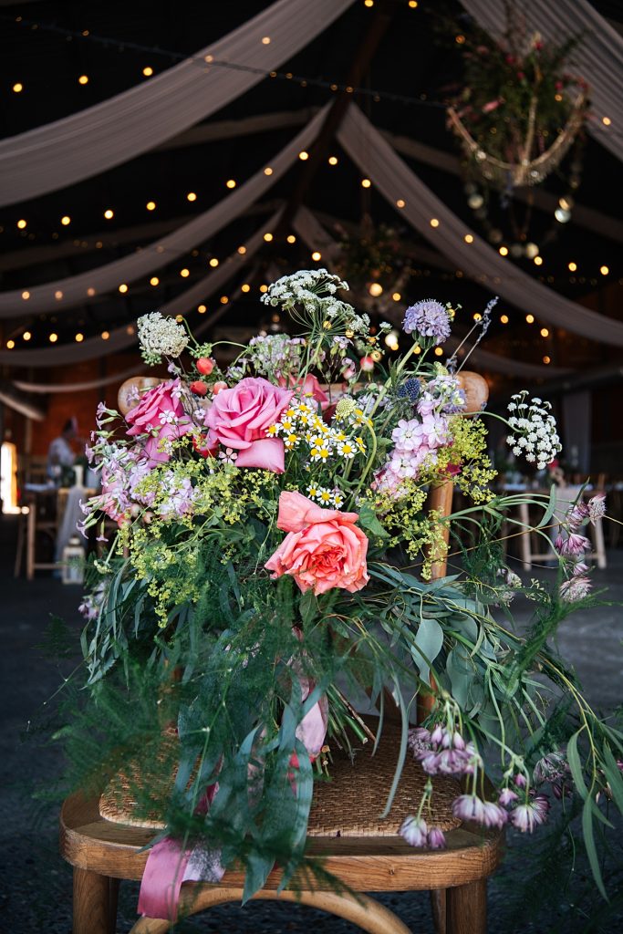 Multi coloured Summer wedding with a bride wearing green at The Barns at Lodge Farm. Essex documentary wedding photographer
