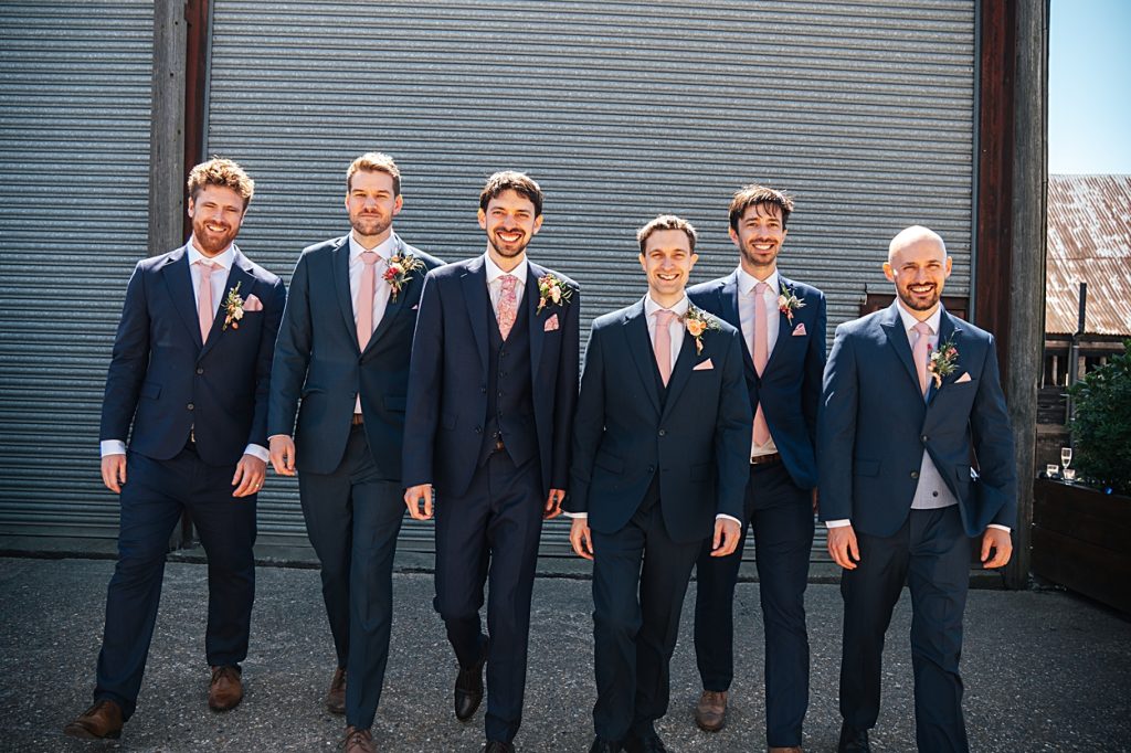 Multi coloured Summer wedding with a bride wearing green at The Barns at Lodge Farm. Essex documentary wedding photographer
