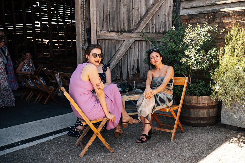 Multi coloured Summer wedding with a bride wearing green at The Barns at Lodge Farm. Essex documentary wedding photographer