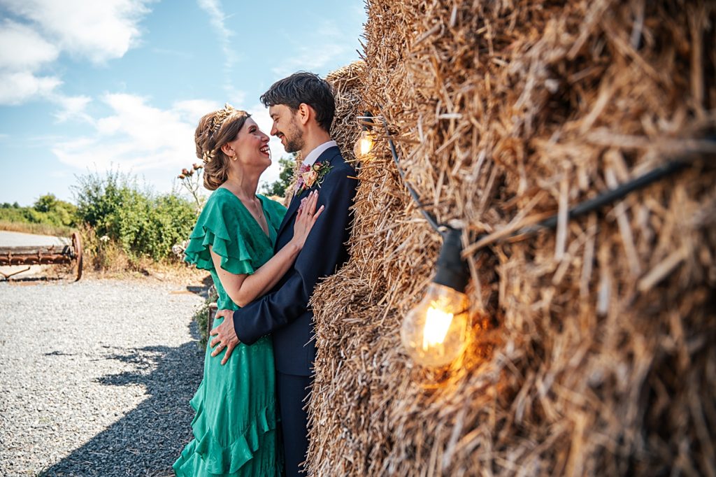 Multi coloured Summer wedding with a bride wearing green at The Barns at Lodge Farm. Essex documentary wedding photographer