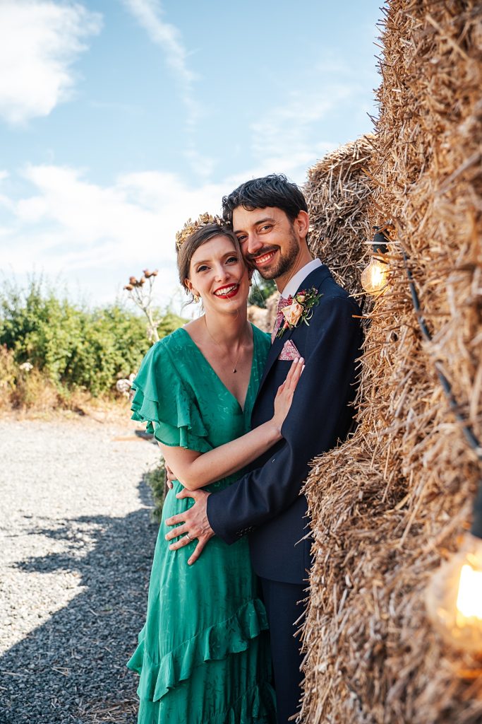 Multi coloured Summer wedding with a bride wearing green at The Barns at Lodge Farm. Essex documentary wedding photographer