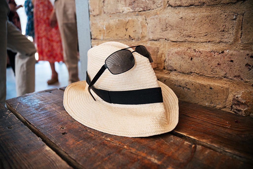 Multi coloured Summer wedding with a bride wearing green at The Barns at Lodge Farm. Essex documentary wedding photographer