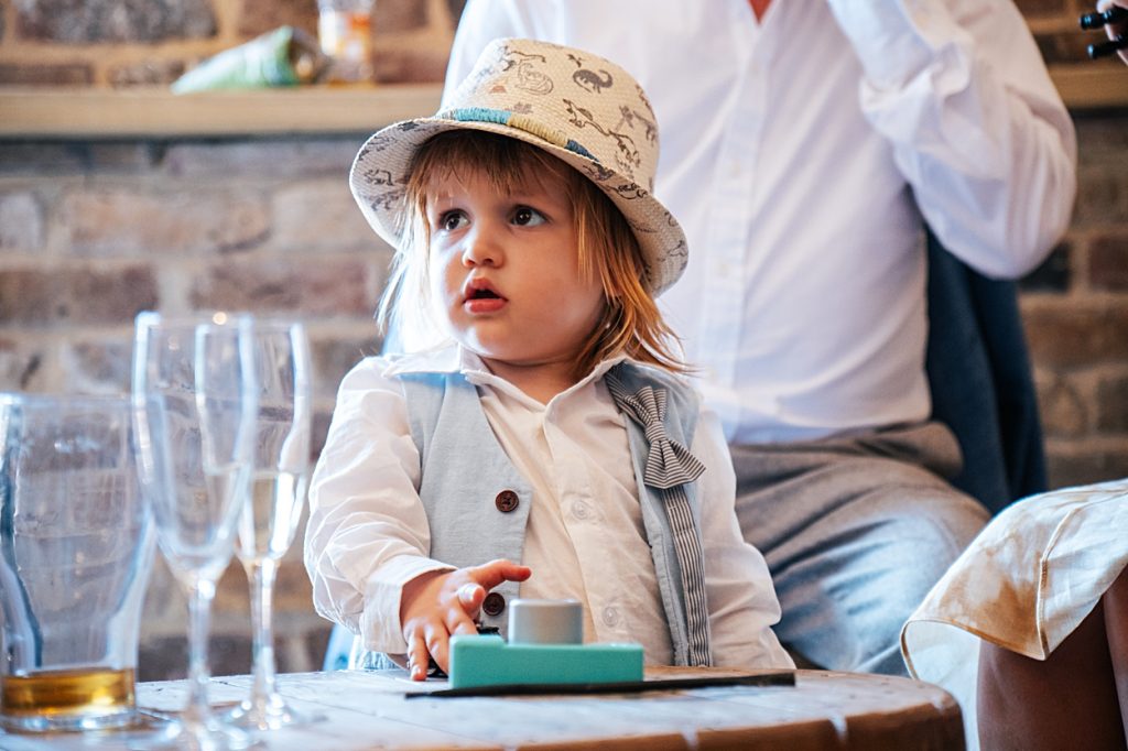Multi coloured Summer wedding with a bride wearing green at The Barns at Lodge Farm. Essex documentary wedding photographer