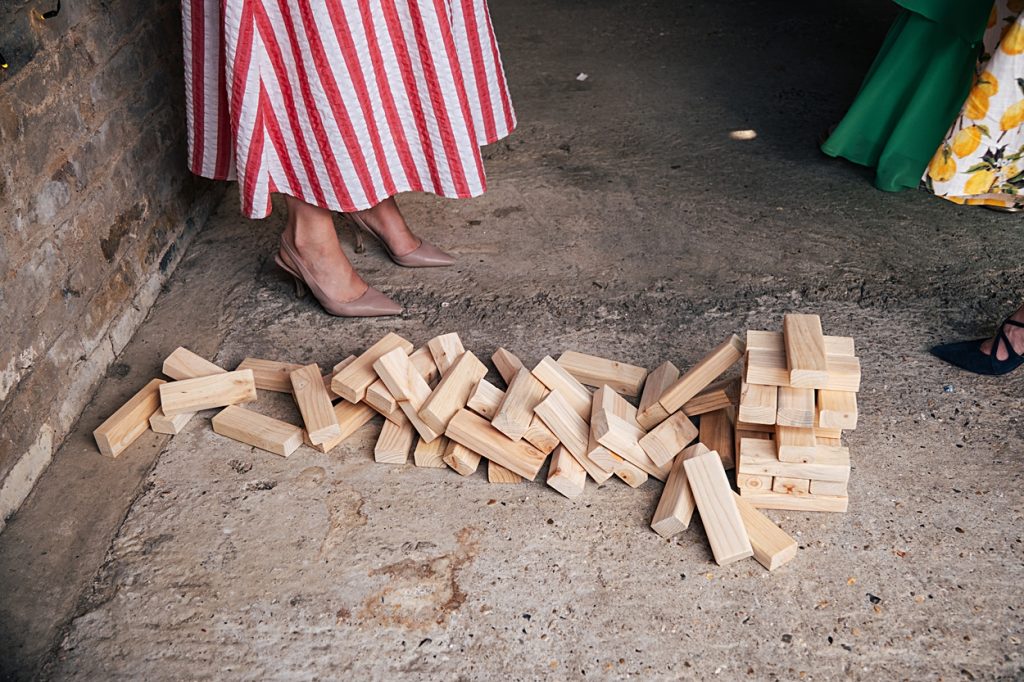 Multi coloured Summer wedding with a bride wearing green at The Barns at Lodge Farm. Essex documentary wedding photographer
