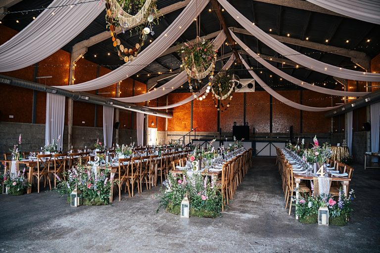 Multi coloured Summer wedding with a bride wearing green at The Barns at Lodge Farm. Essex documentary wedding photographer