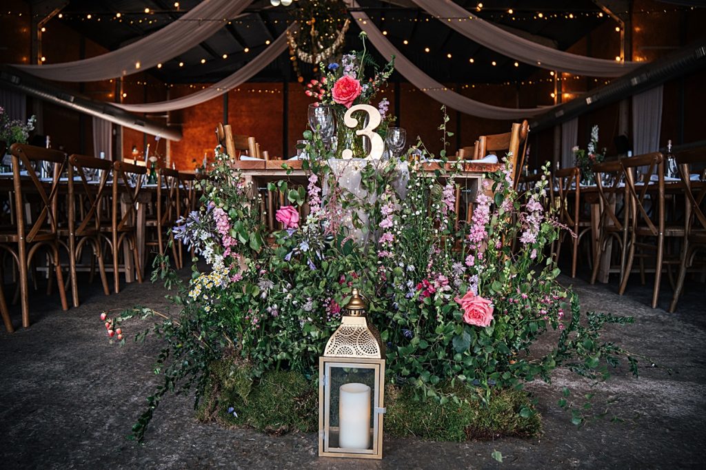 Multi coloured Summer wedding with a bride wearing green at The Barns at Lodge Farm. Essex documentary wedding photographer