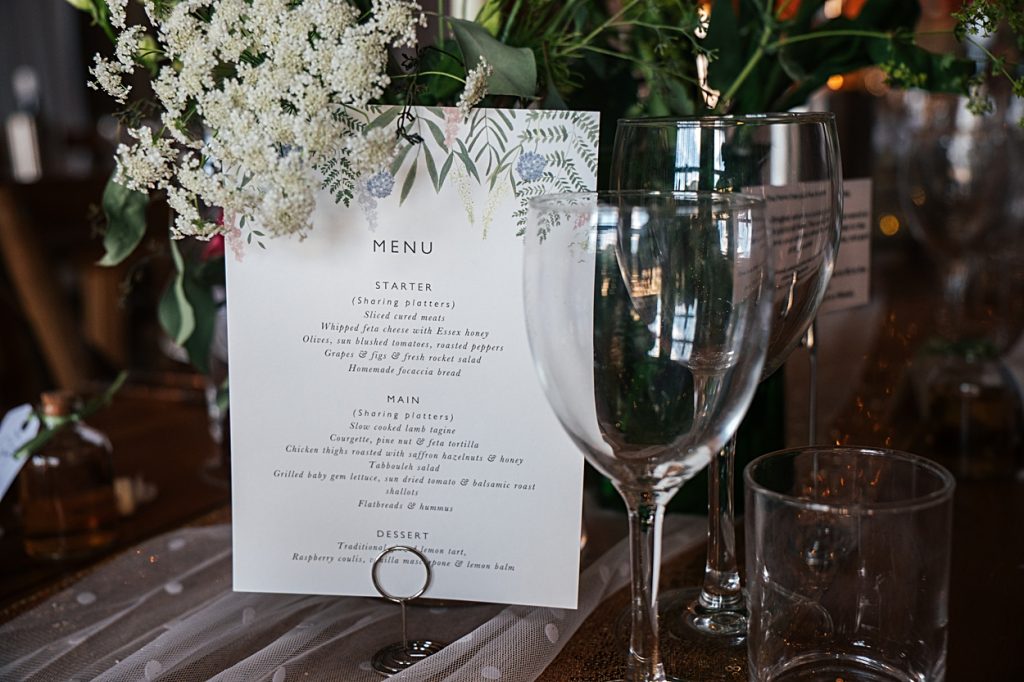 Multi coloured Summer wedding with a bride wearing green at The Barns at Lodge Farm. Essex documentary wedding photographer